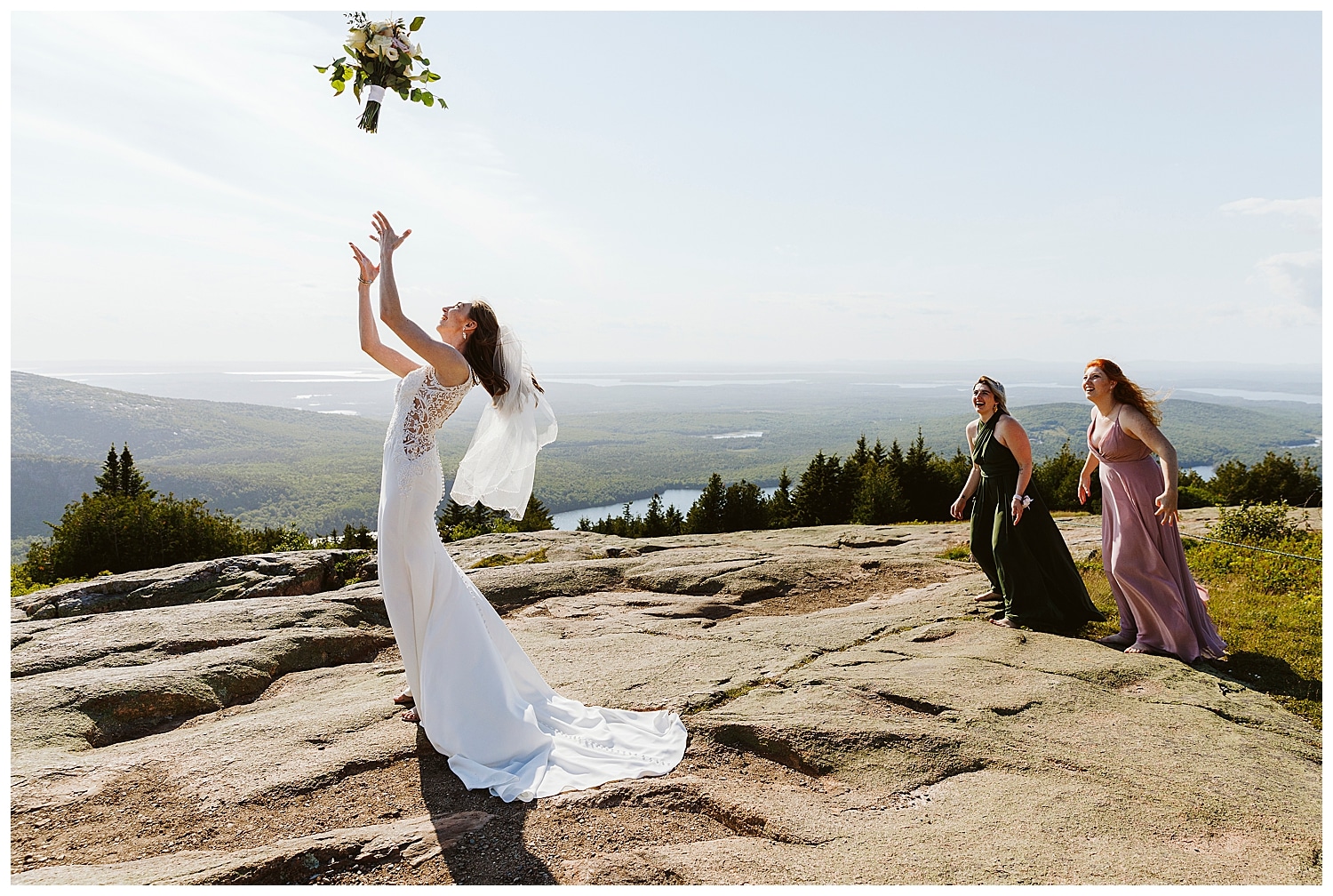 bouquet toss on Cadillac Mountain during elopement in Acadia National Park