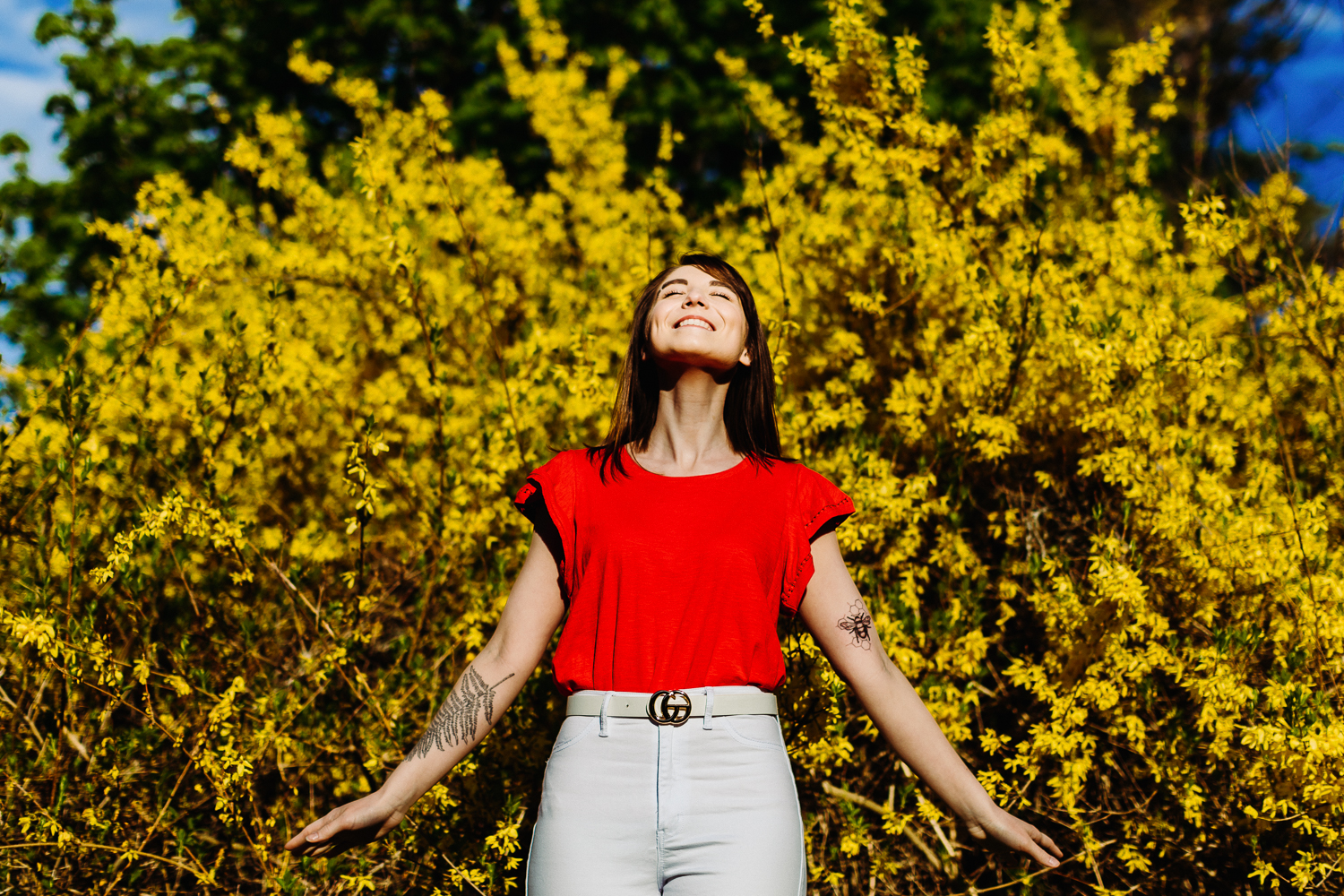 portrait of a woman in front of forsythia in Bangor Maine
