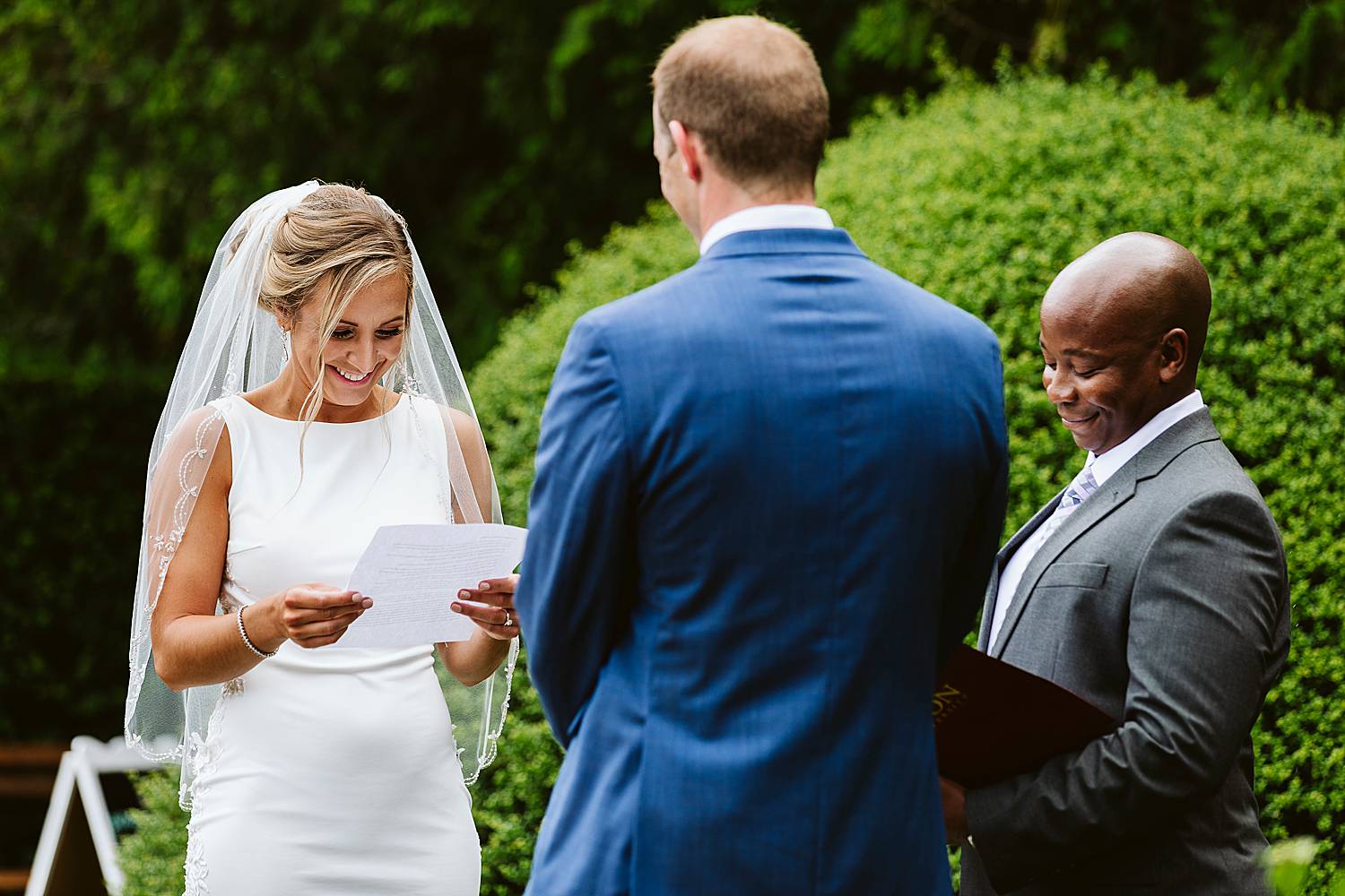bride reads vows at Fuller Gardens wedding