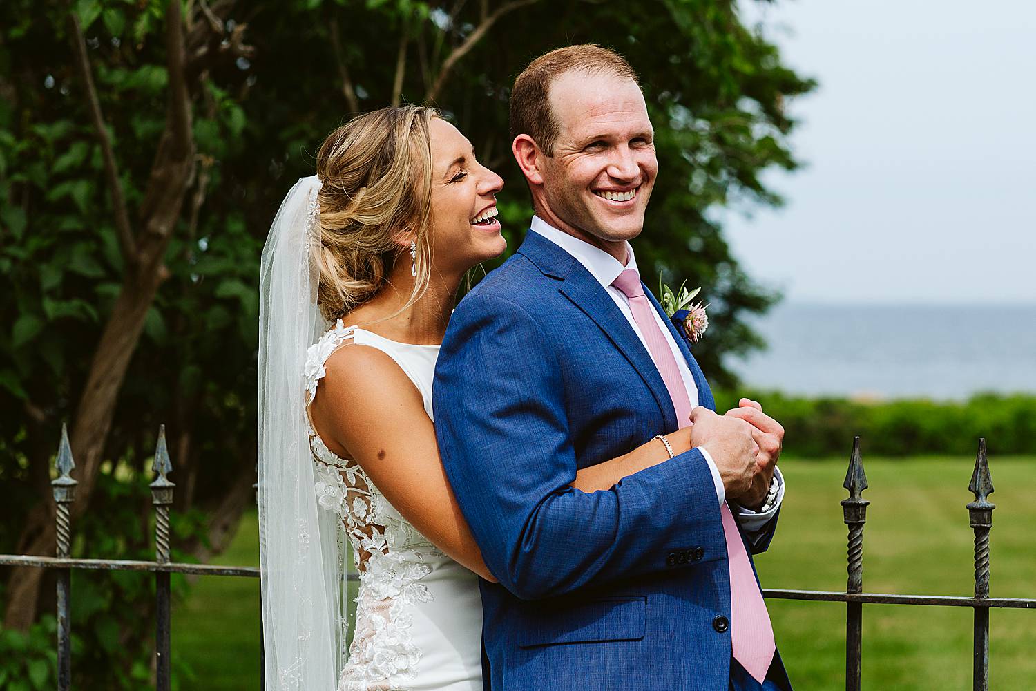 Bride and groom laughing together photographed by North Hampton, NH wedding photographer at Fuller Gardens