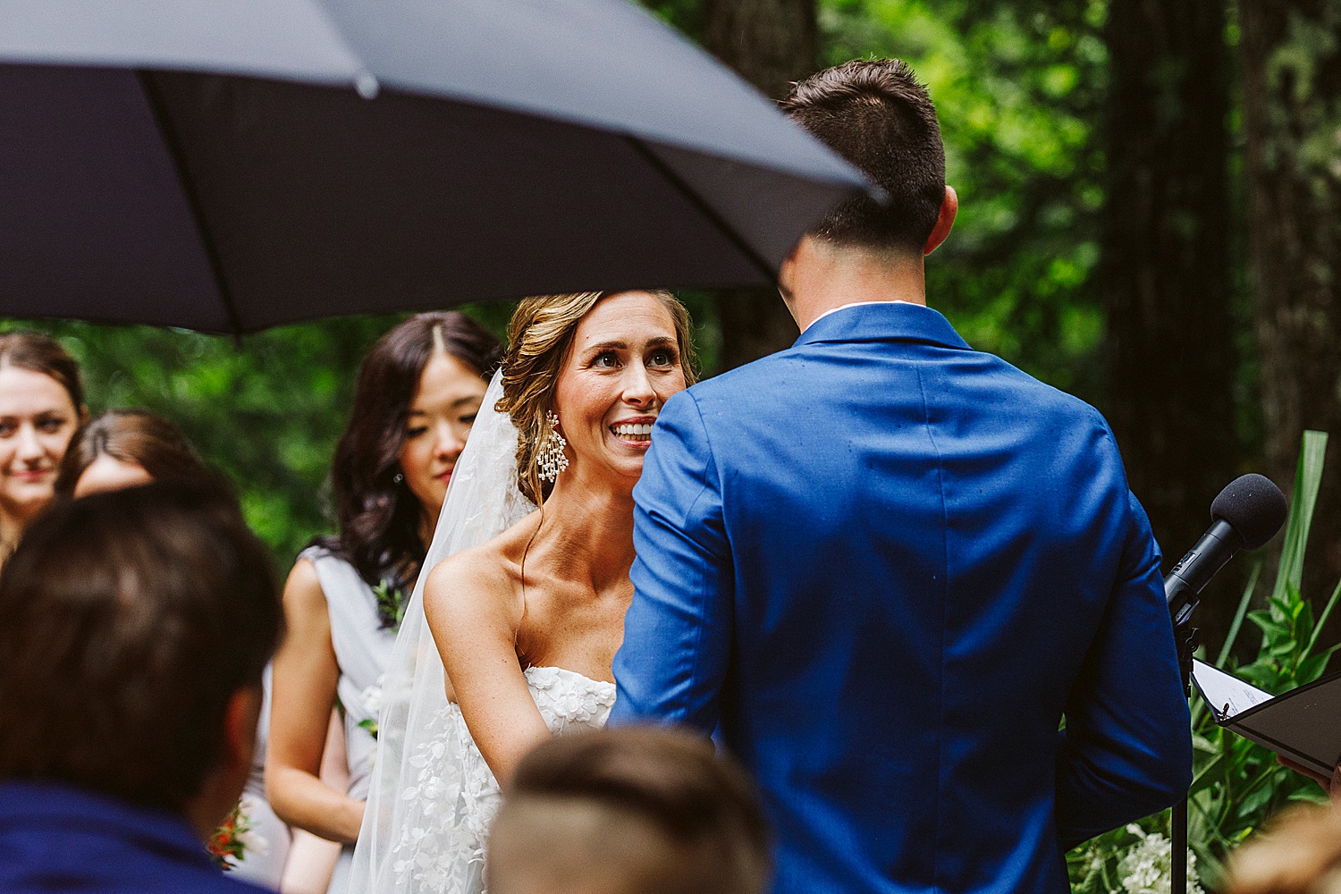 bride smiling at groom during Maine wedding ceremony