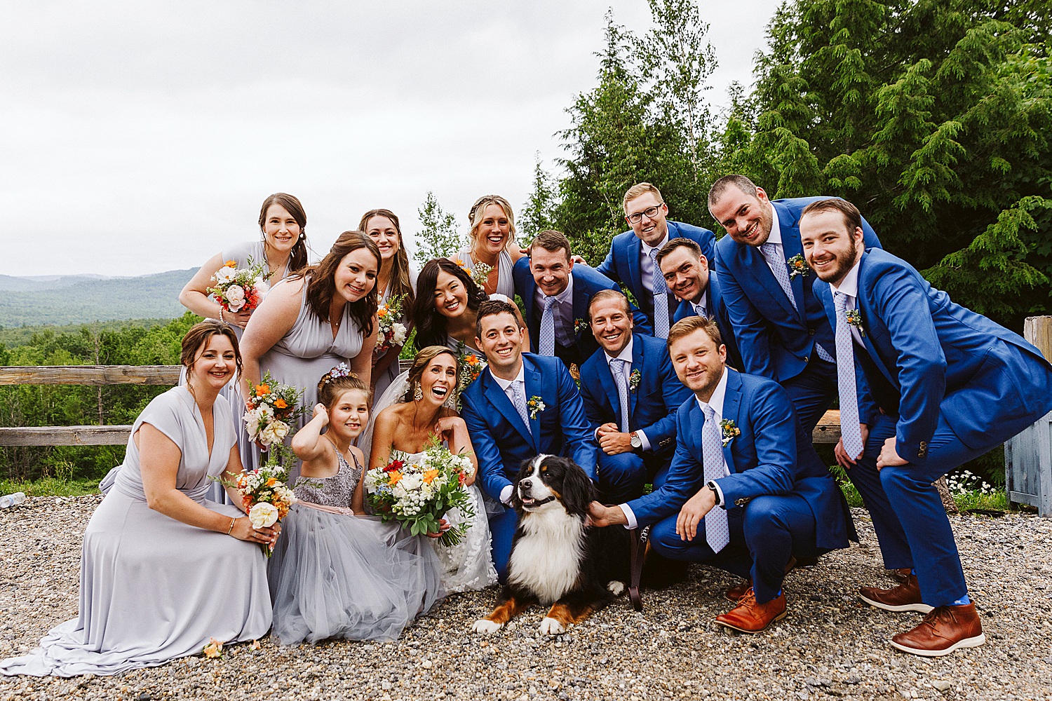 wedding party posing with dog at Maine wedding at Granite Ridge Estate & Barn
