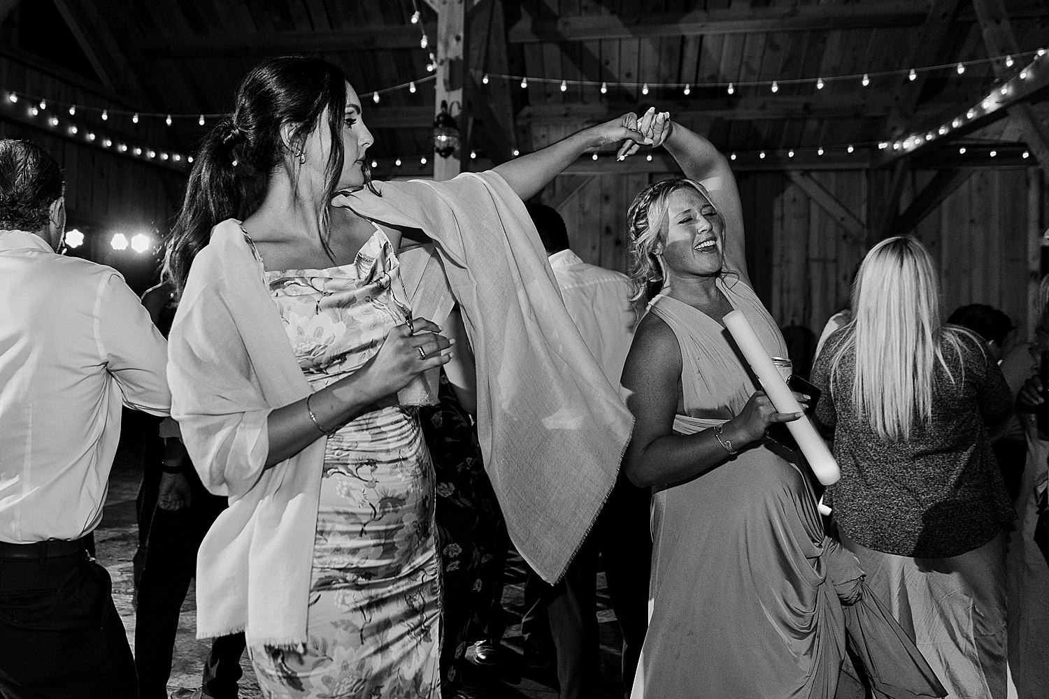 bridesmaid dancing with wedding guest