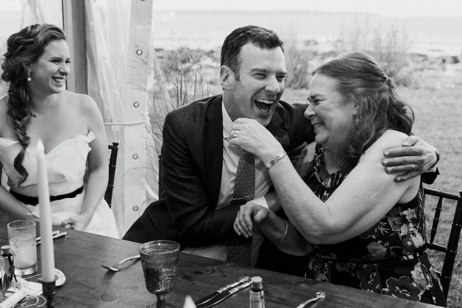 groom laughing with his mom