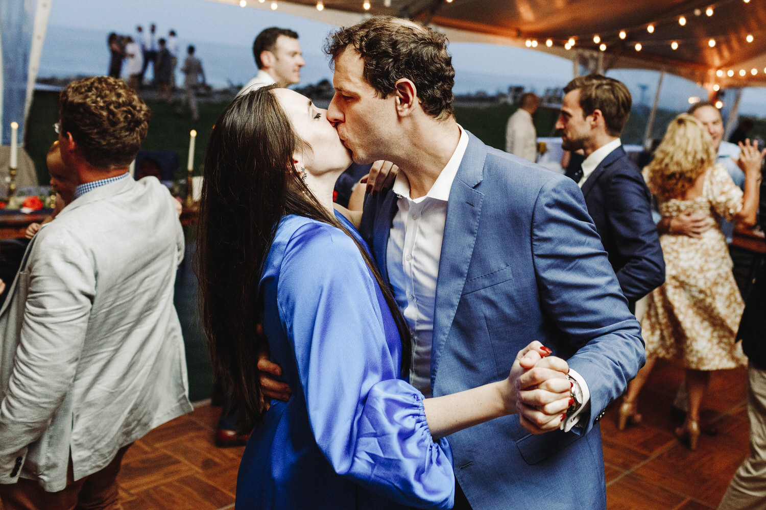 wedding guests kissing on dance floor at Seacoast Science Center