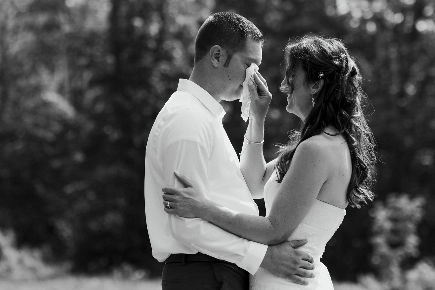 groom crying during first look at backyard wedding in Northport, Maine