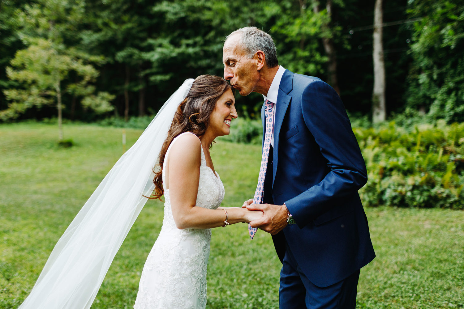 father of the bride kissing her forehead at Arlington, Vermont wedding