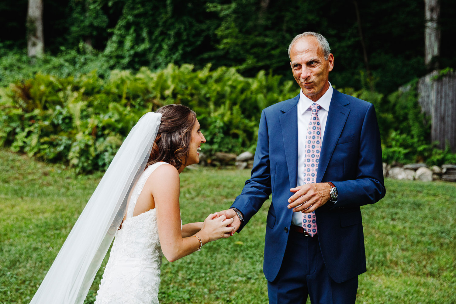 bride and her father laughing together 