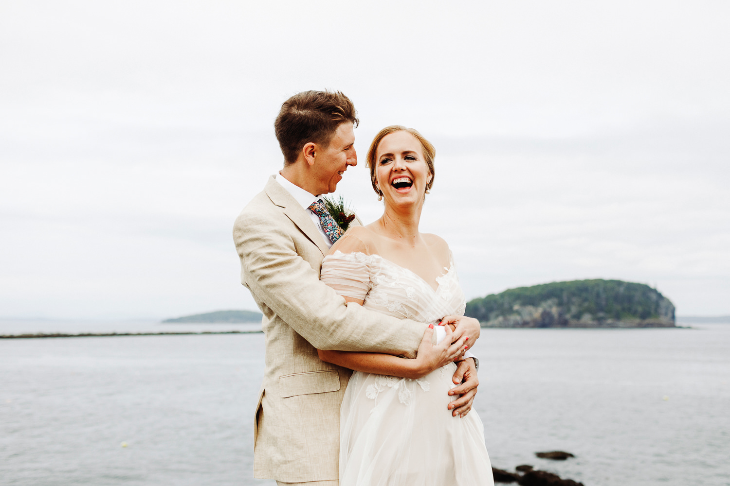 Bride and groom on cliffs at August wedding in Bar Harbor