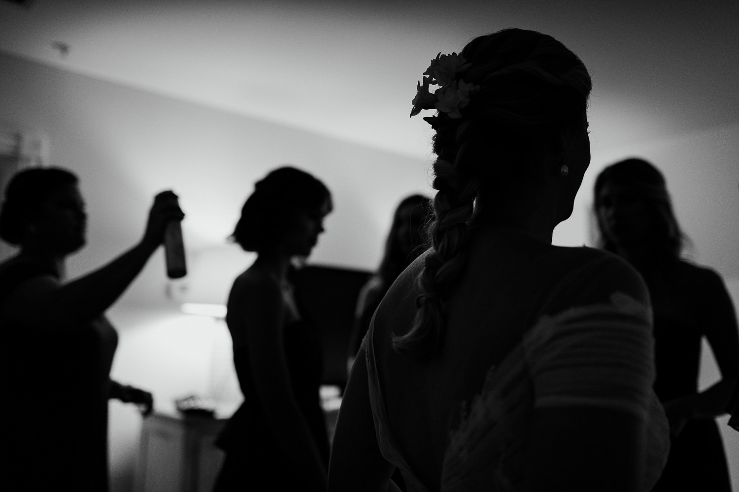 silhouette of bride and bridesmaids getting ready