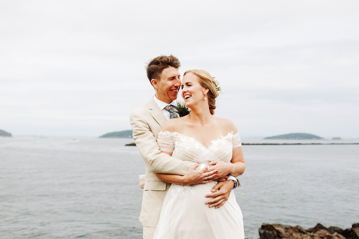 bride and groom laughing together at August wedding in Bar Harbor