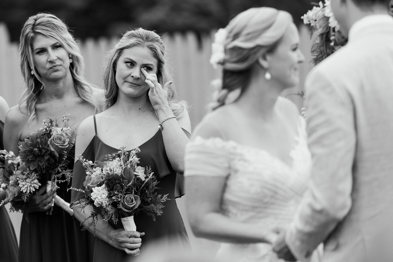 maid of honor crying during wedding ceremony at August wedding in Bar Harbor