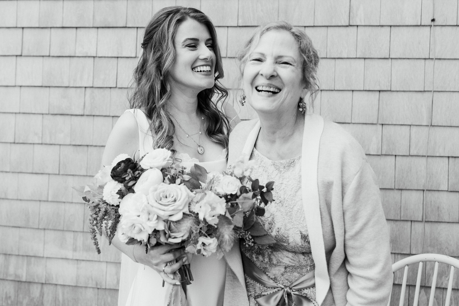 bride laughing with her mother at Orr's Island Maine Wedding