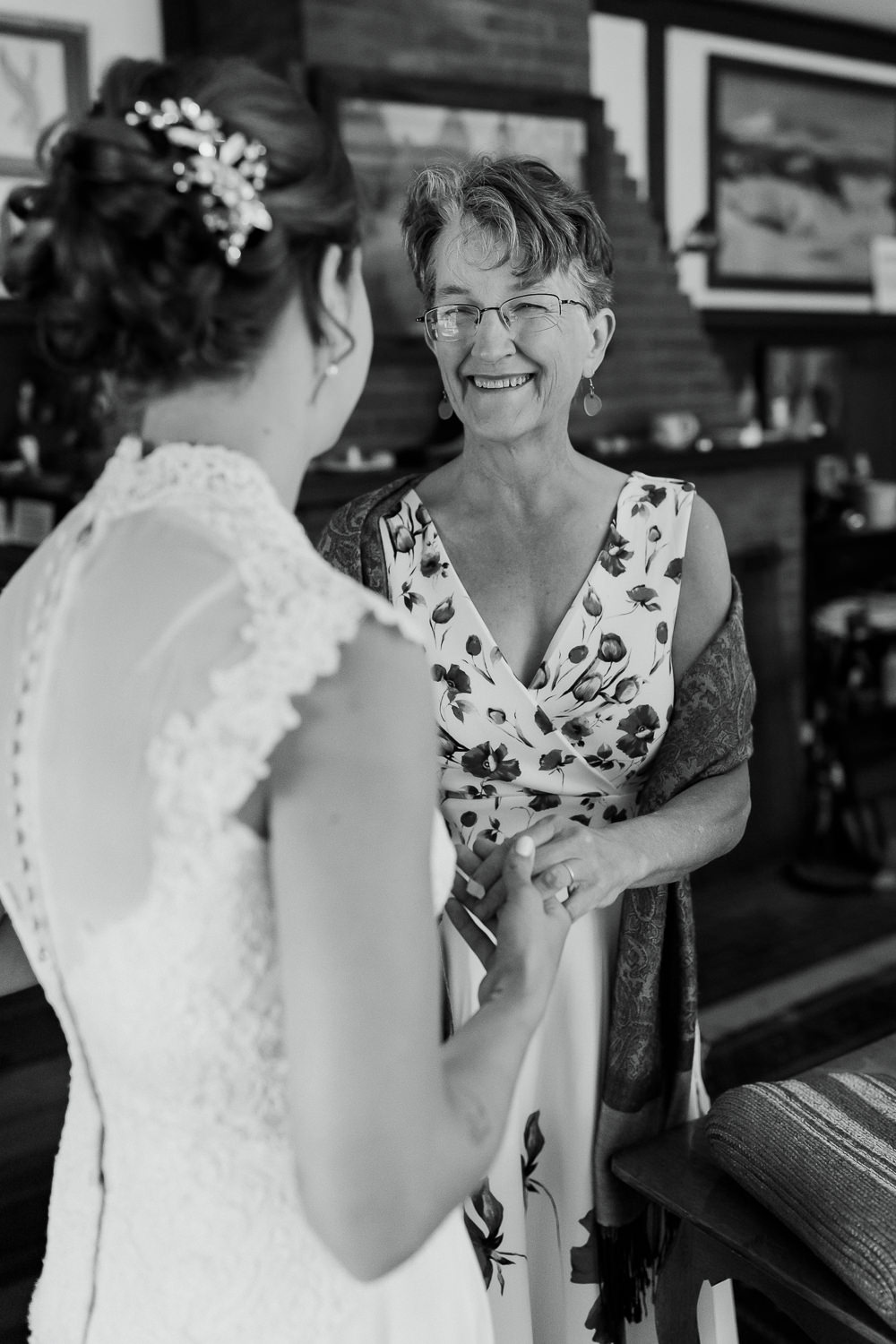 Bride's mother smiling at her before Sutton Island Maine wedding