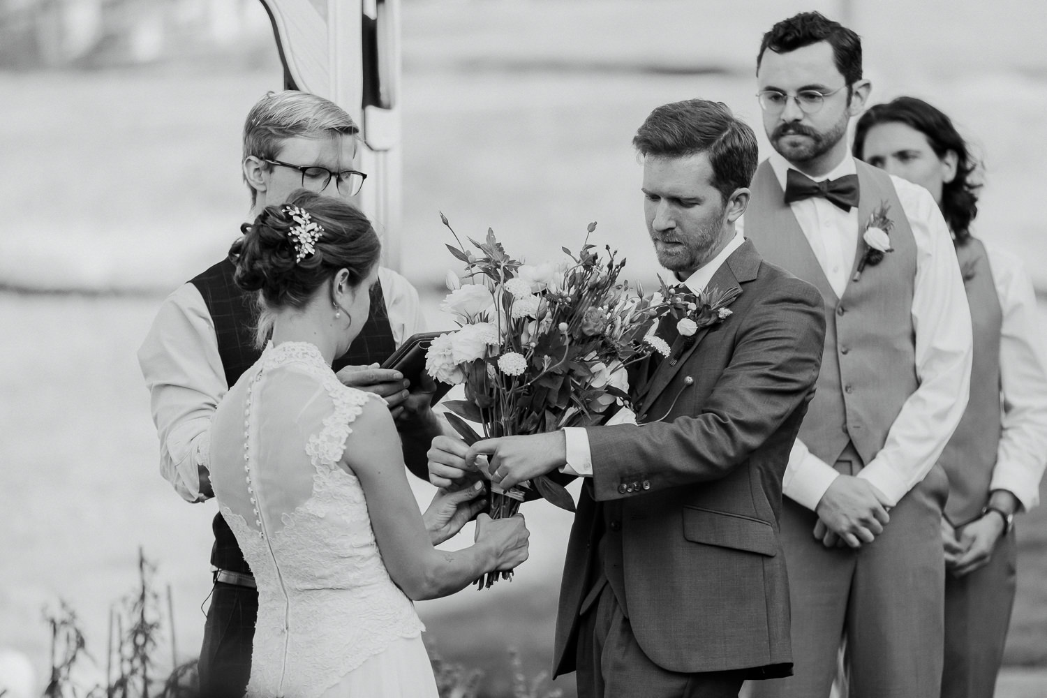 Bride and groom assembling bouquet