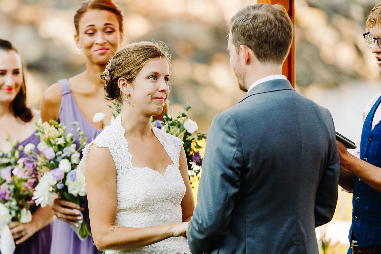 Bride smiling at groom during vows