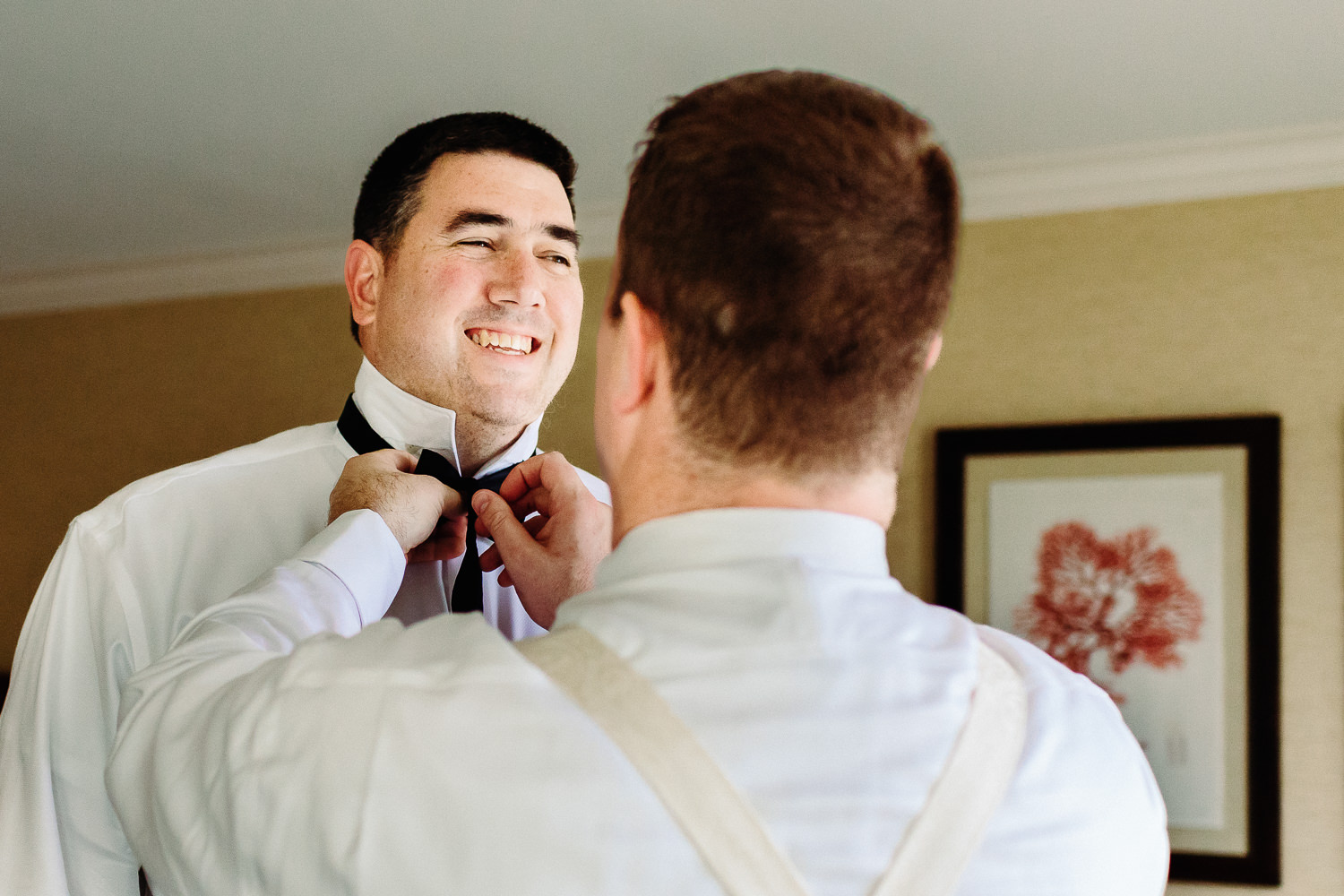 groom getting his tie tied at Stage Neck Inn wedding in York Maine