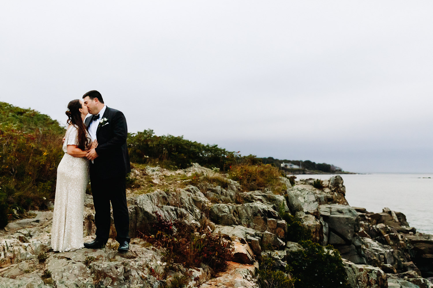 bride and groom on cliffs at Stage Neck Inn wedding in York Maine