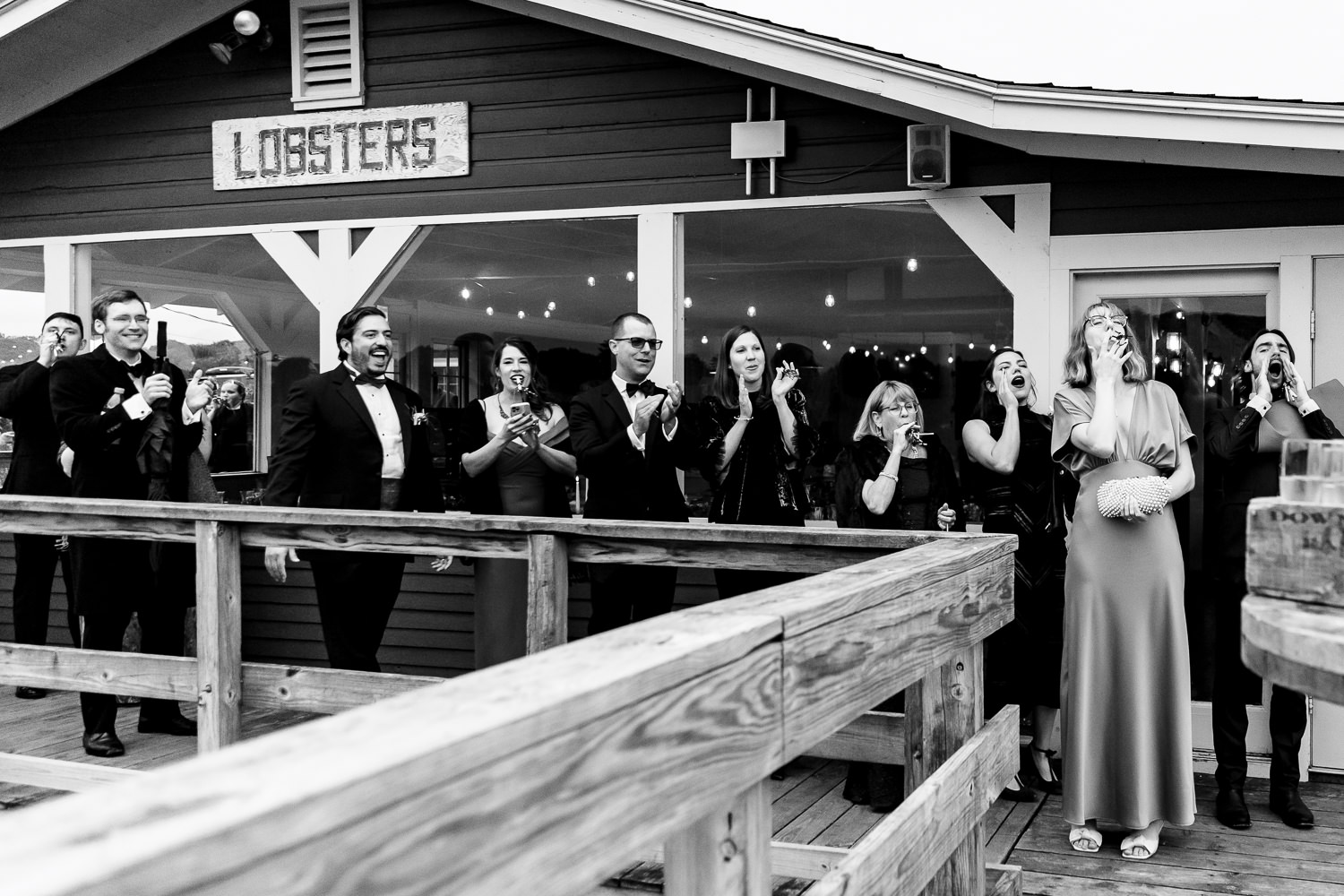 wedding guests cheer on bride and groom at The Contented Sole in New Harbor Maine