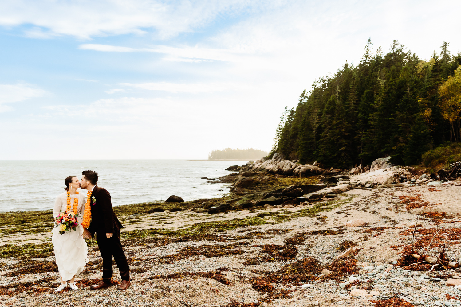 couple on beach at Deer Isle Aragosta wedding in Maine