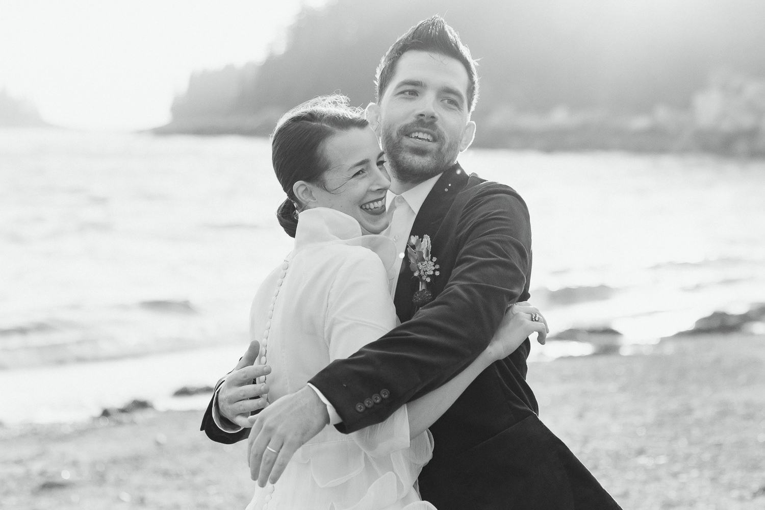 couple hugging during Deer Isle wedding at Aragosta