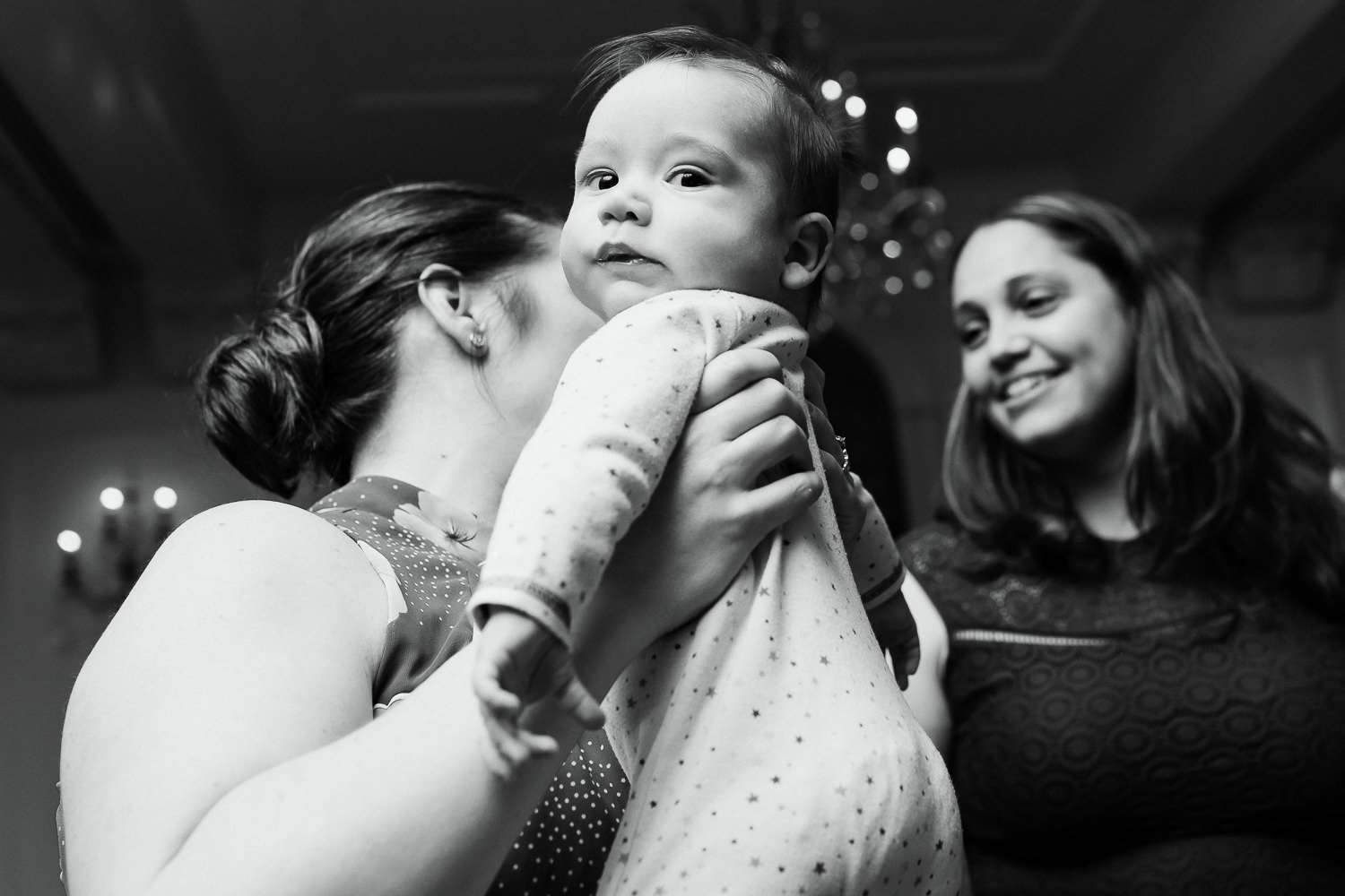 Baby looking at camera at New Castle NH wedding celebration