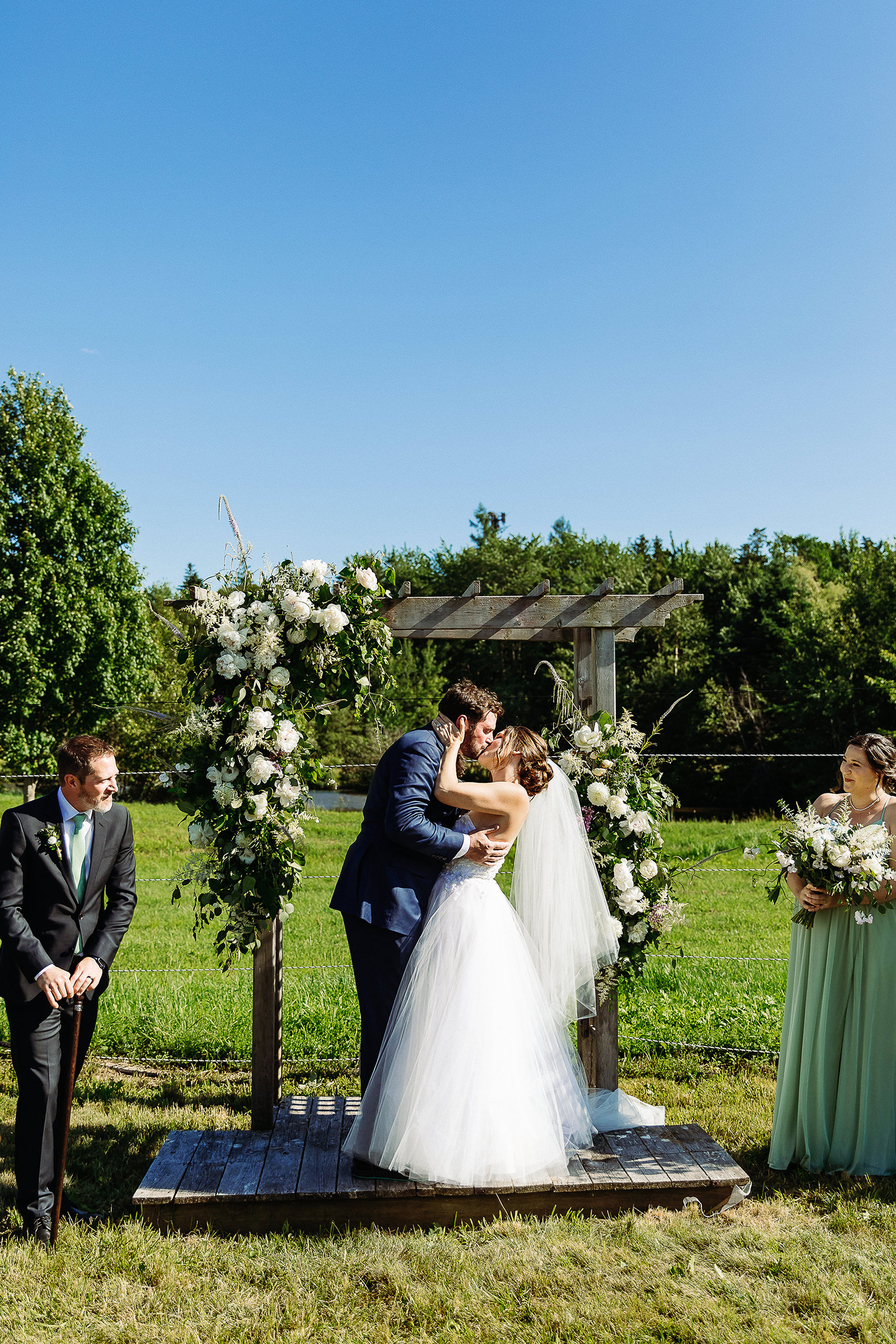 first kiss at Sweet Pea's Farm wedding in Bar Harbor Maine