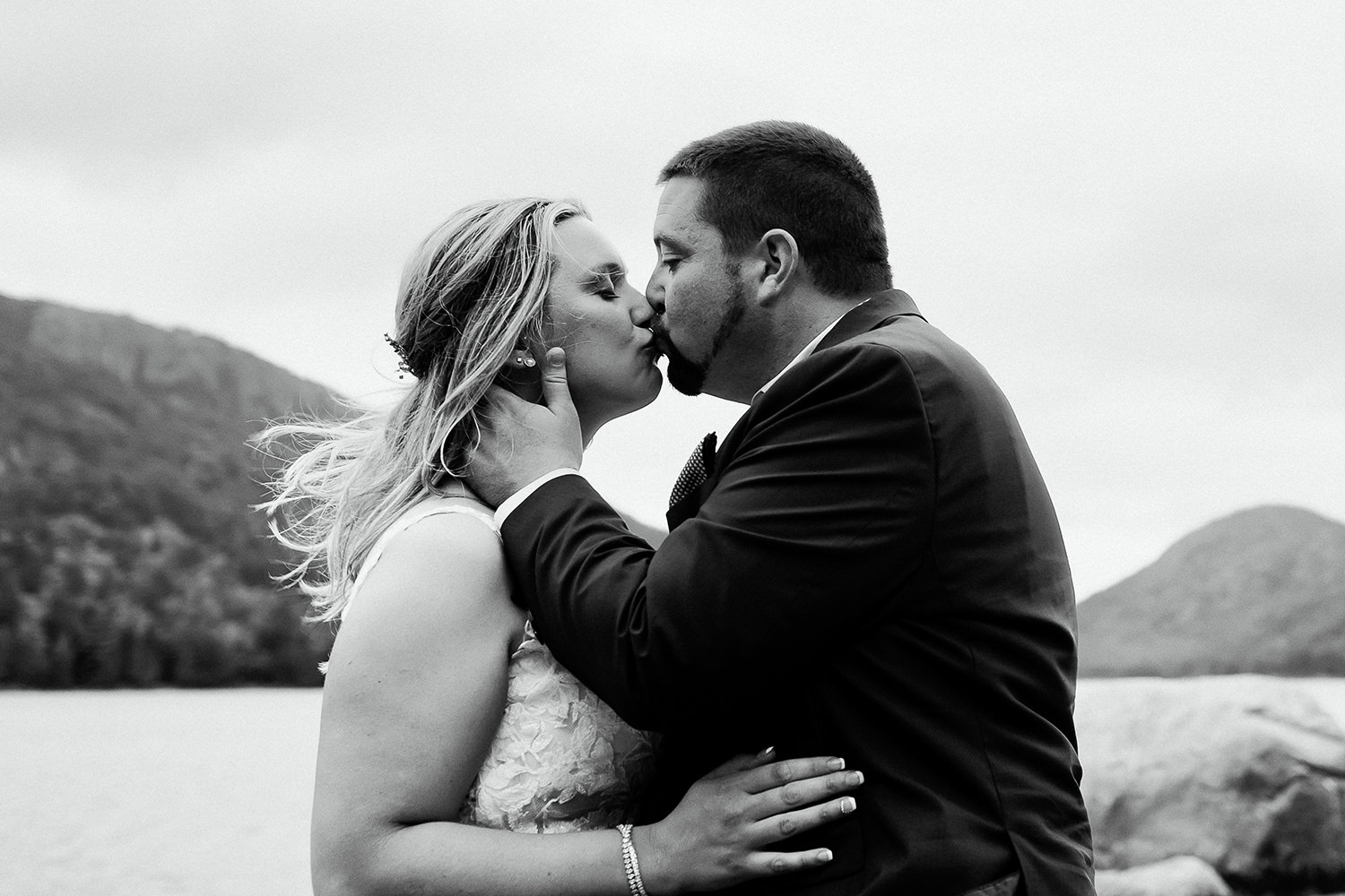 couple kissing at cliffside Acadia elopement