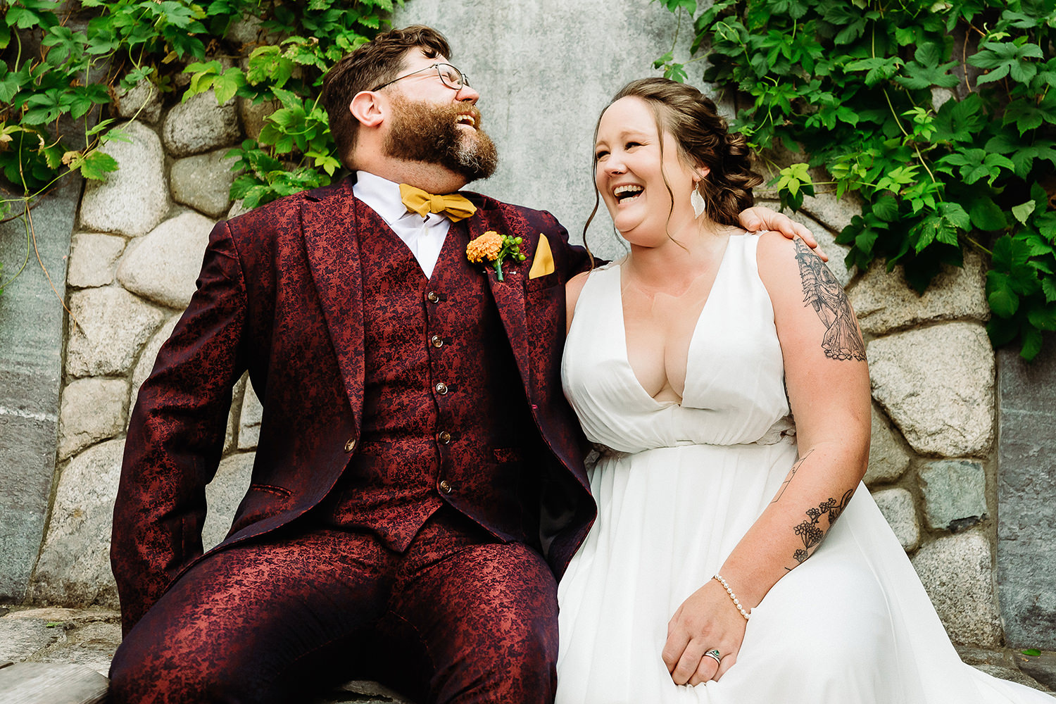 couple laughing at Portland Maine brewery wedding