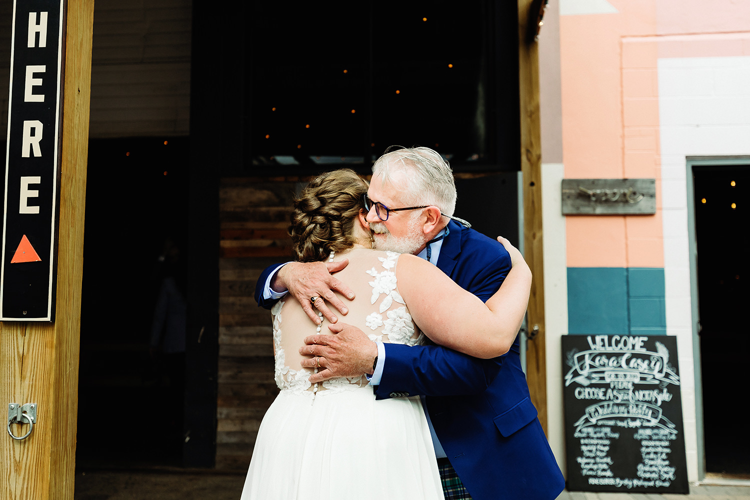 bride hugging her dad at Portland Maine brewery wedding