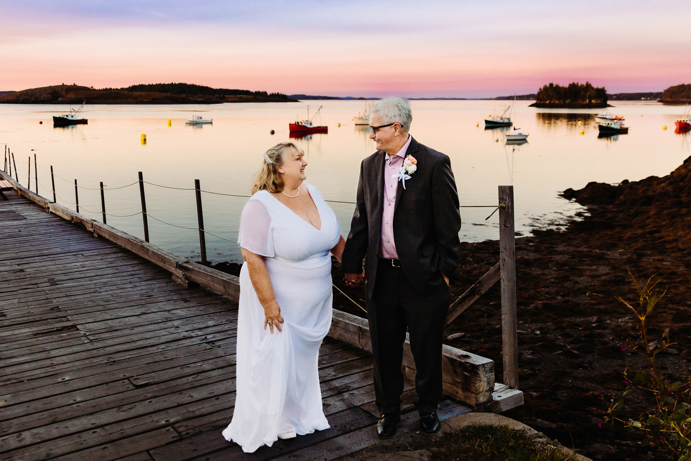 Bride and groom enjoying the sunset after their Lubec Maine wedding