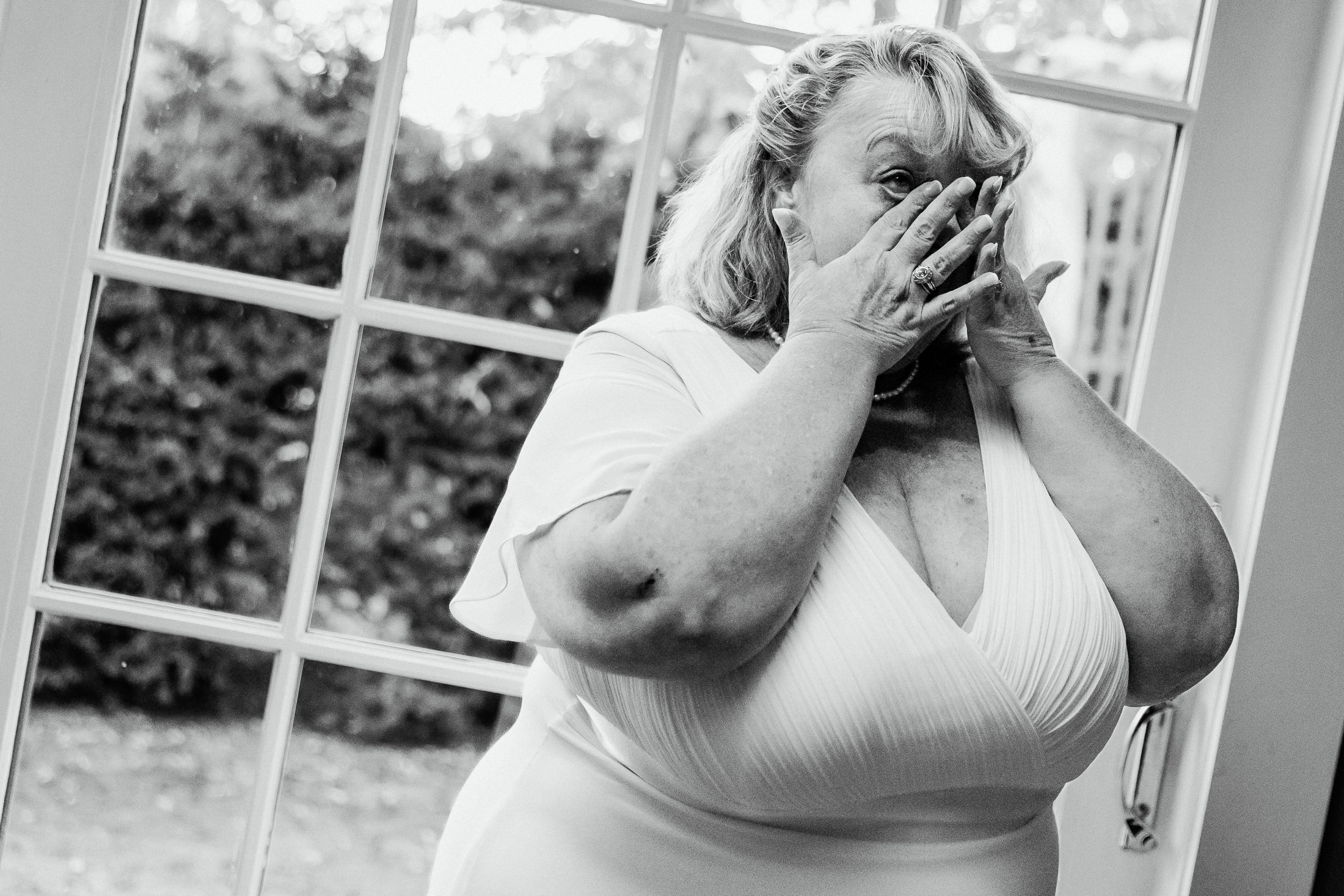 bride wiping her tears before wedding ceremony in Lubec Maine