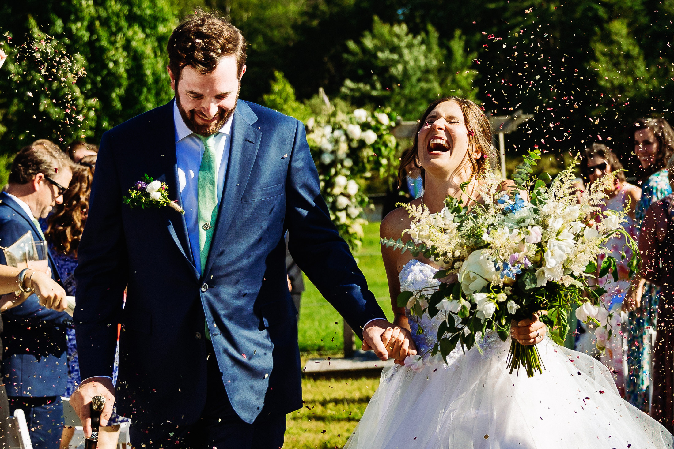 Bride laughing during Bar Harbor Maine wedding recessional