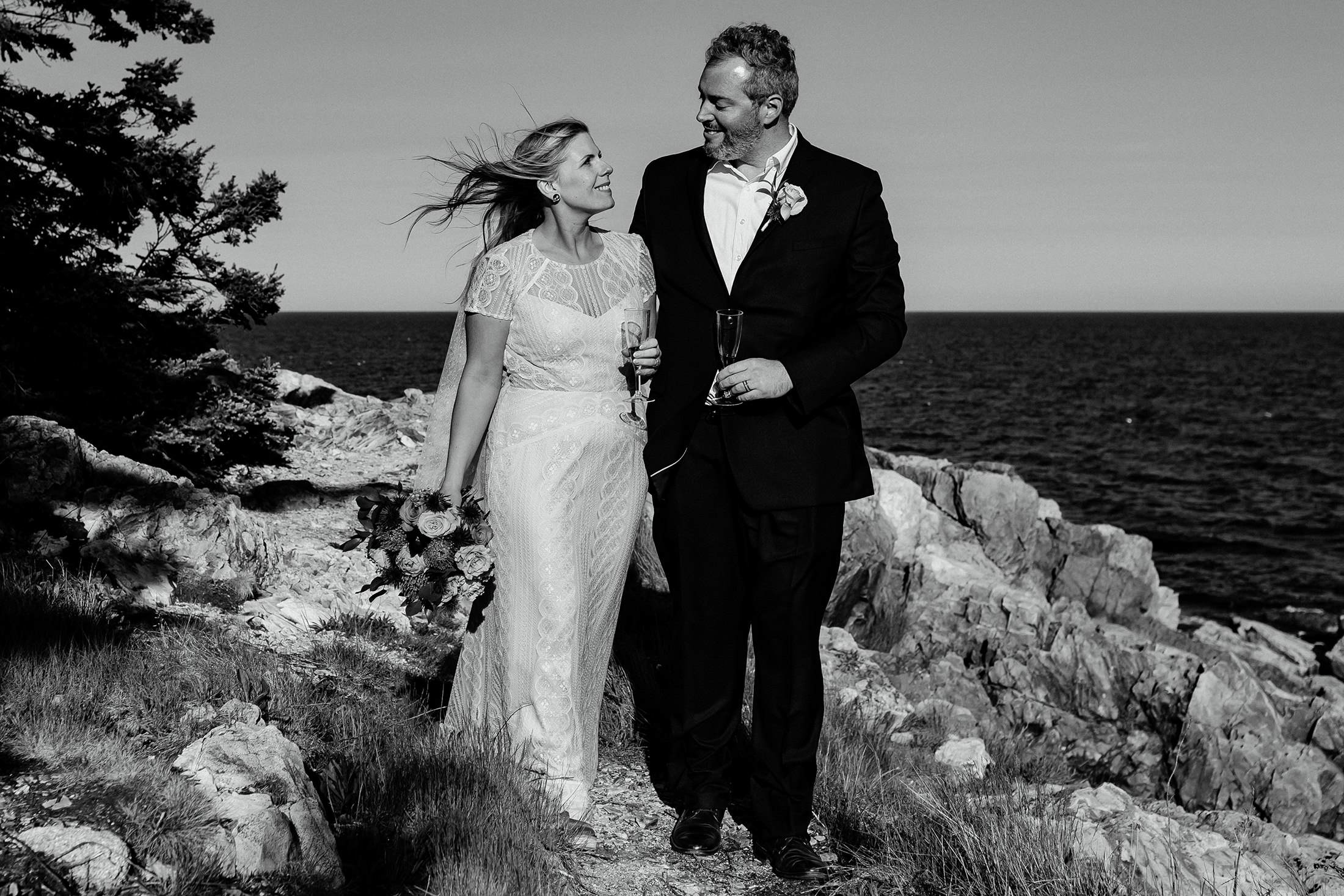 bride and groom with champagne after Otter Point Acadia elopement