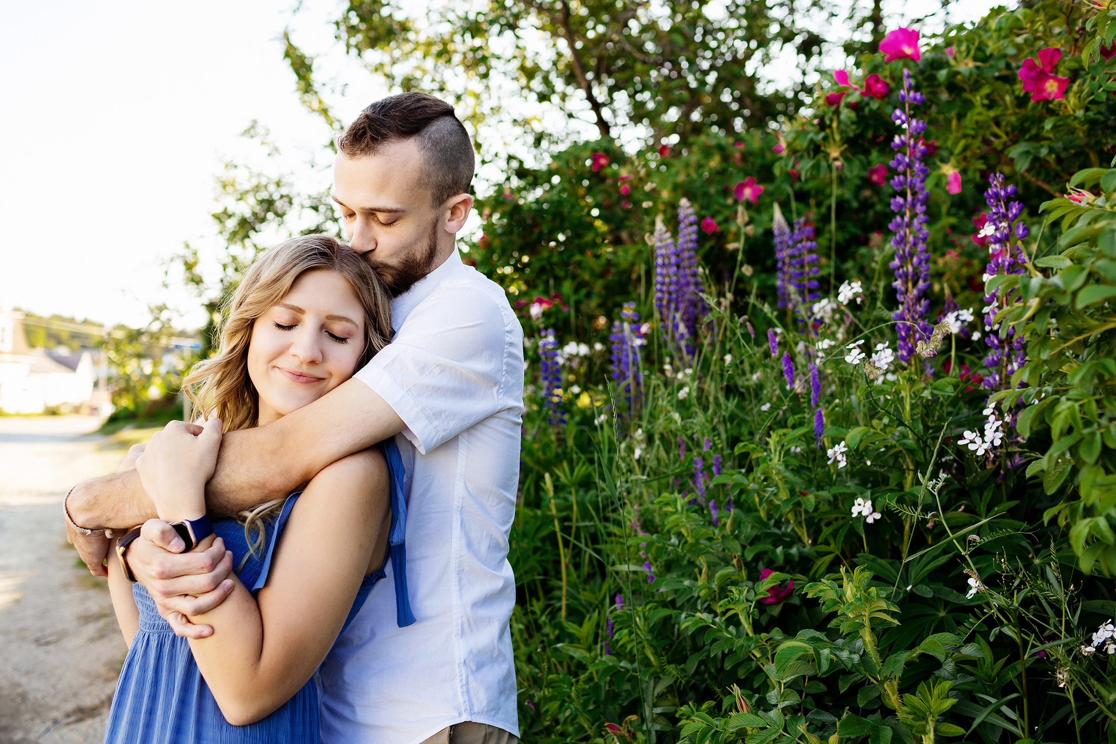 couple cuddling during Stonington Maine engagement photos