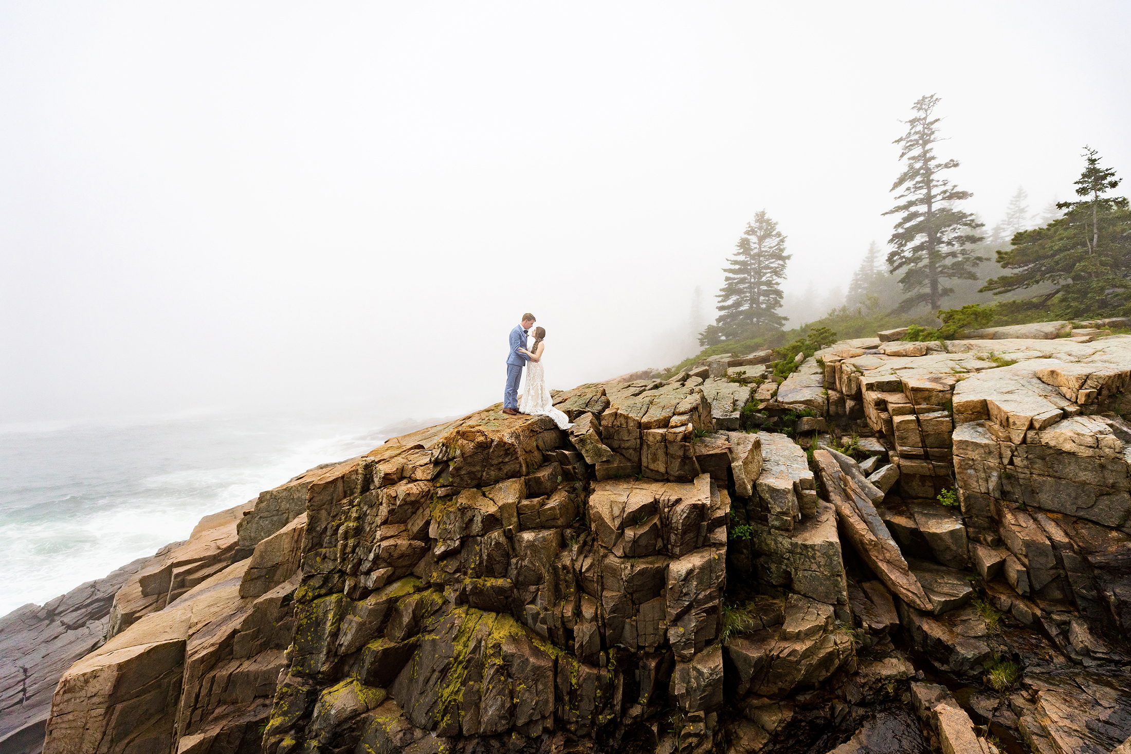 Newlyweds on cliffs in Acadia National Park