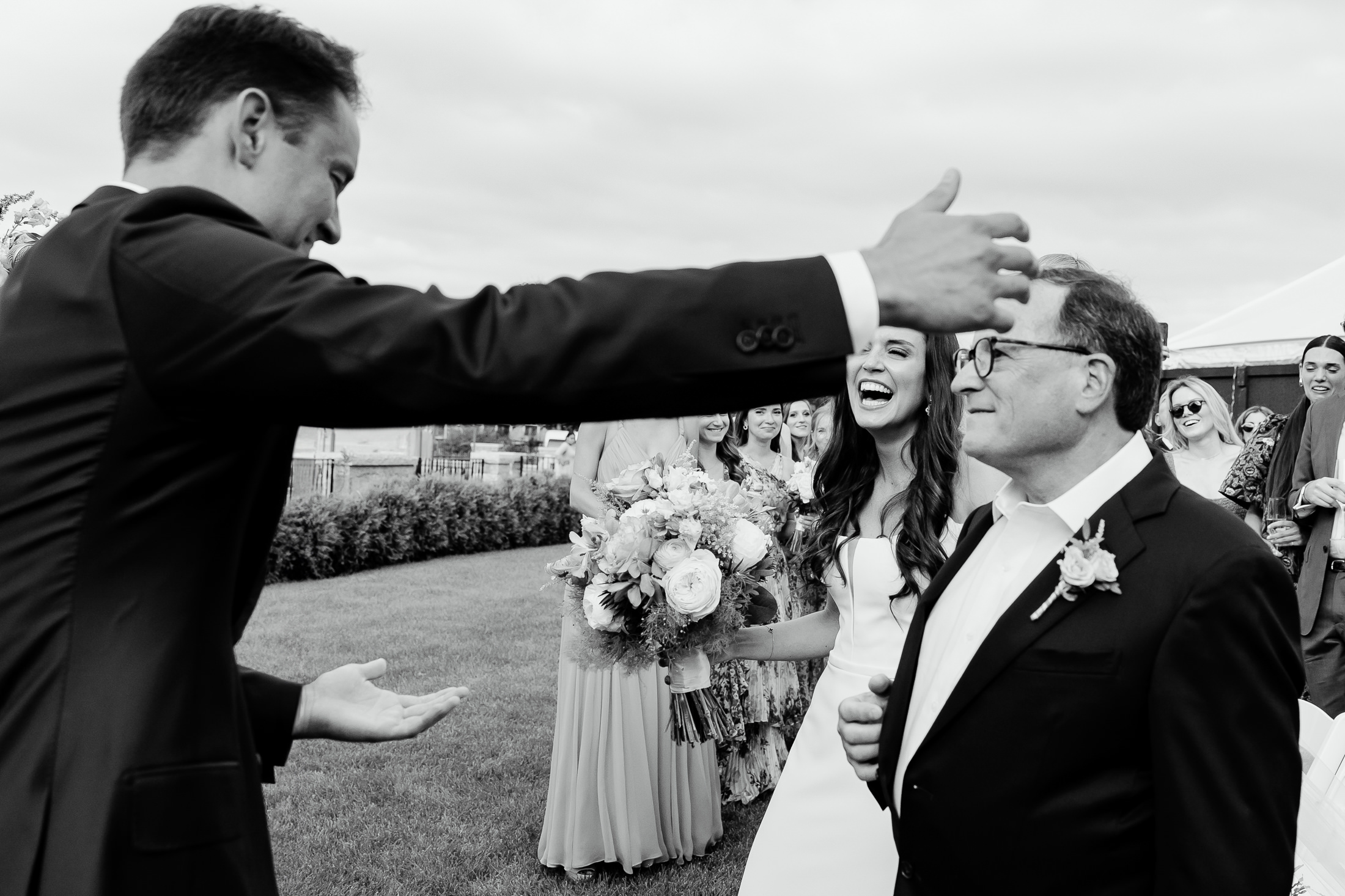groom goes in to hug the father of the bride at Bar Harbor Club wedding