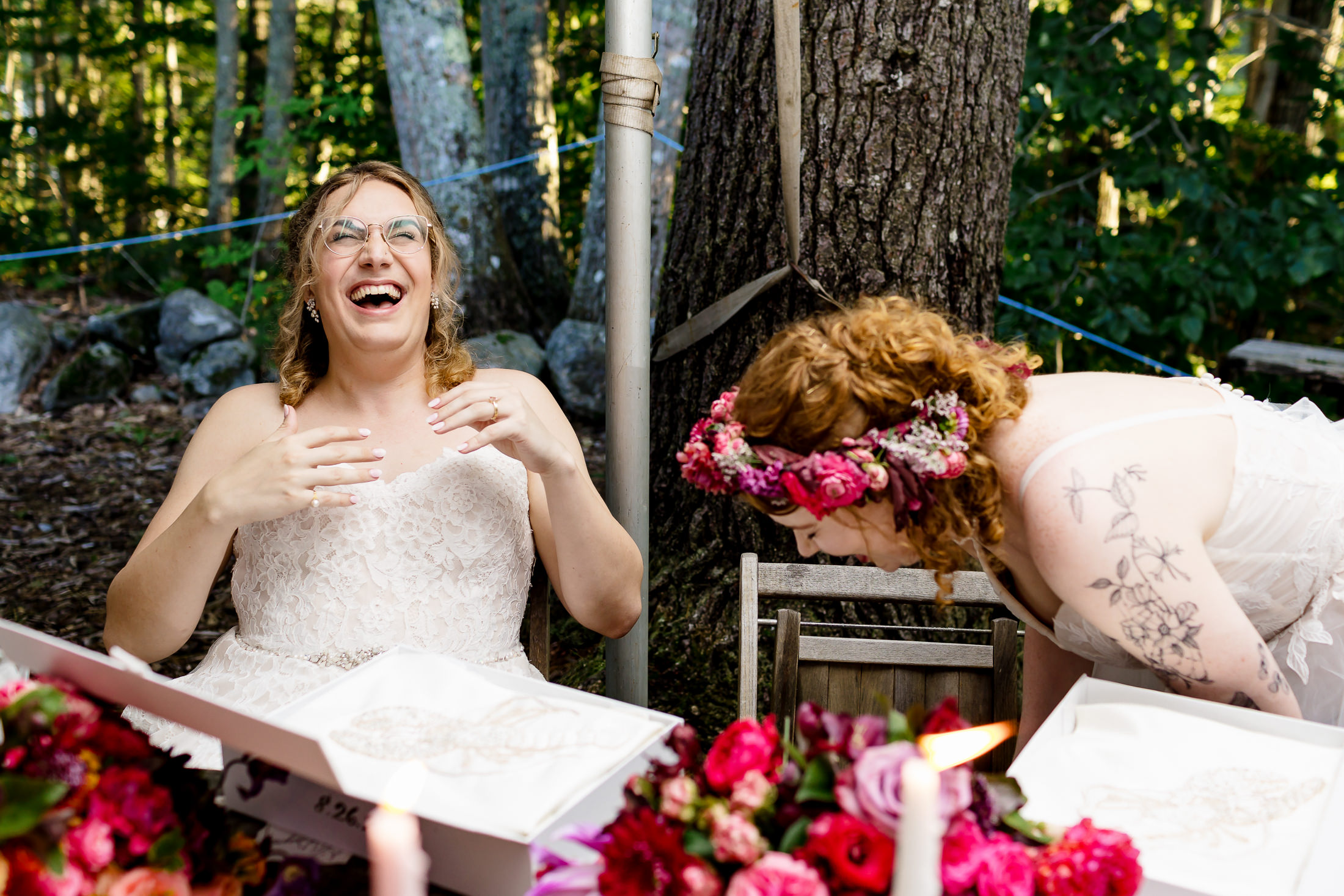 Birdes laughing during their Edgecomb Maine wedding at Glidden Point Oyster Farms