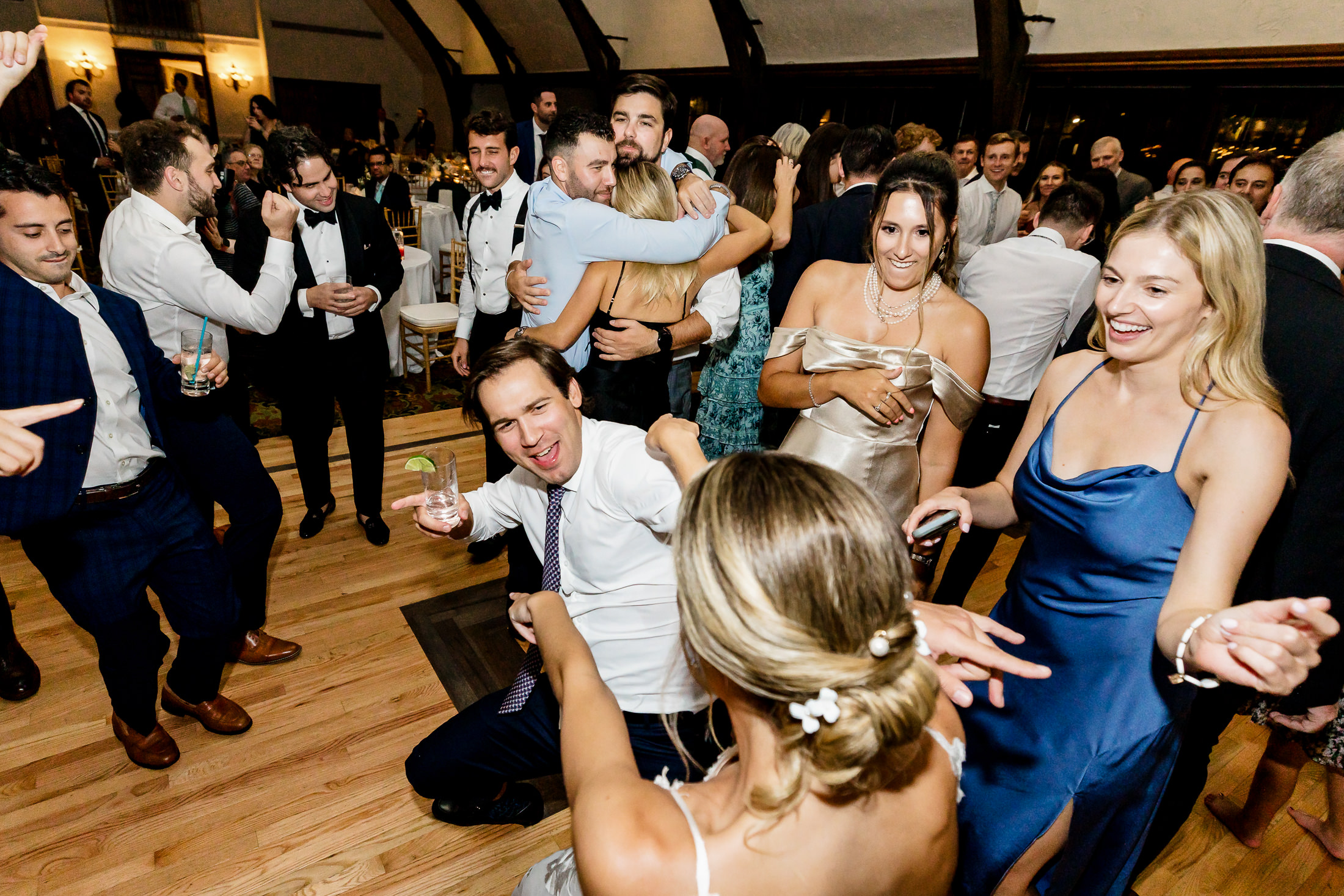 bride dancing with guests at stormy Bar Harbor wedding