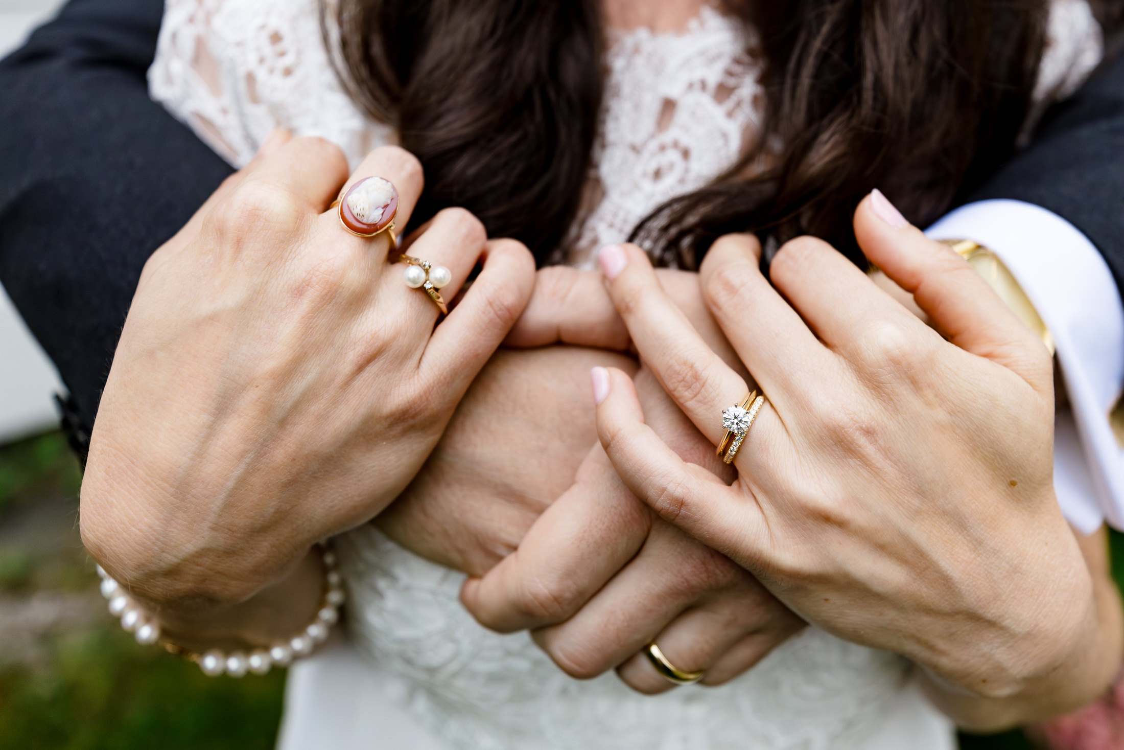 Close-up of couple's hands with their wedding rings after Camden Maine wedding ceremony