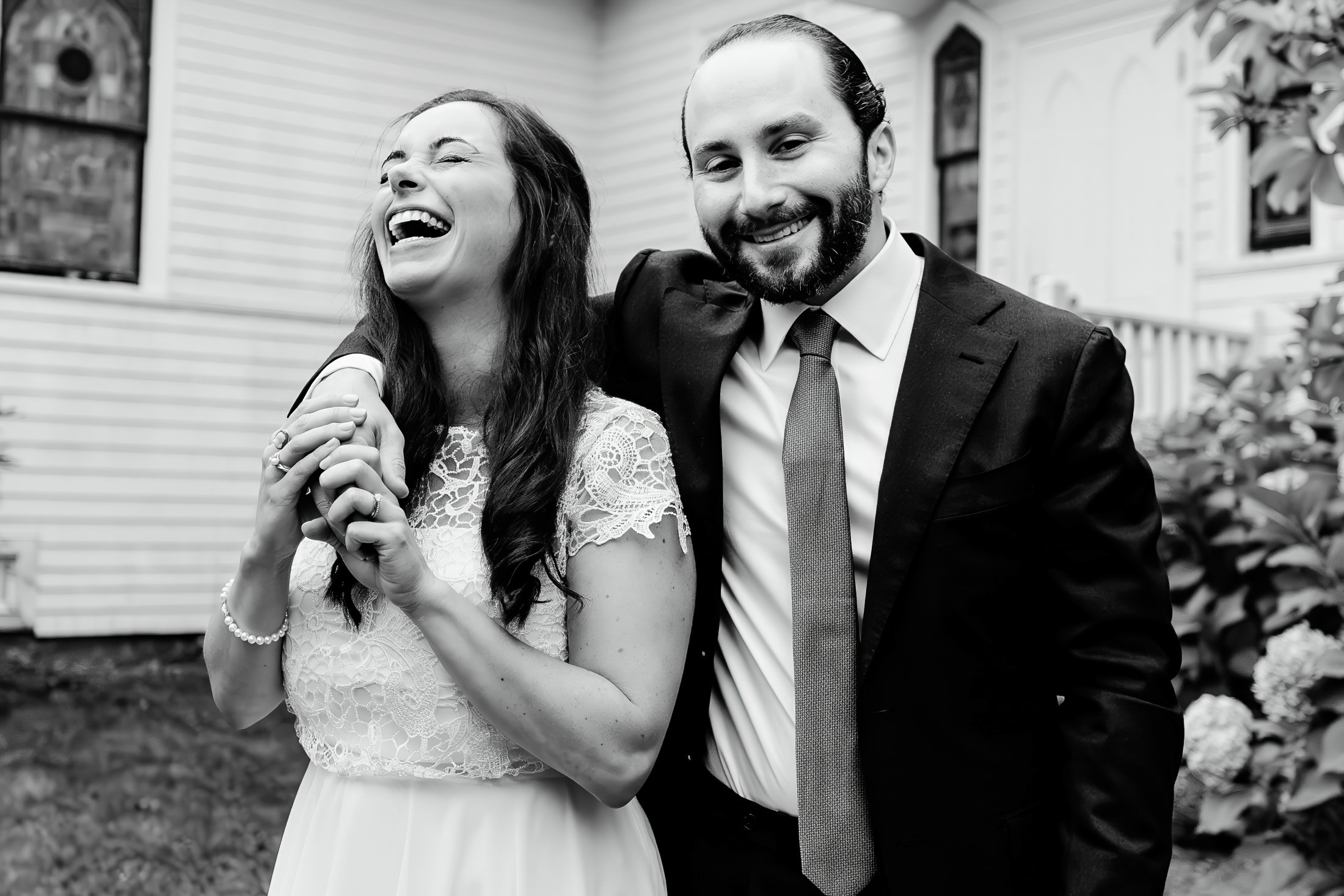 bride and groom laughing after Camden Maine wedding