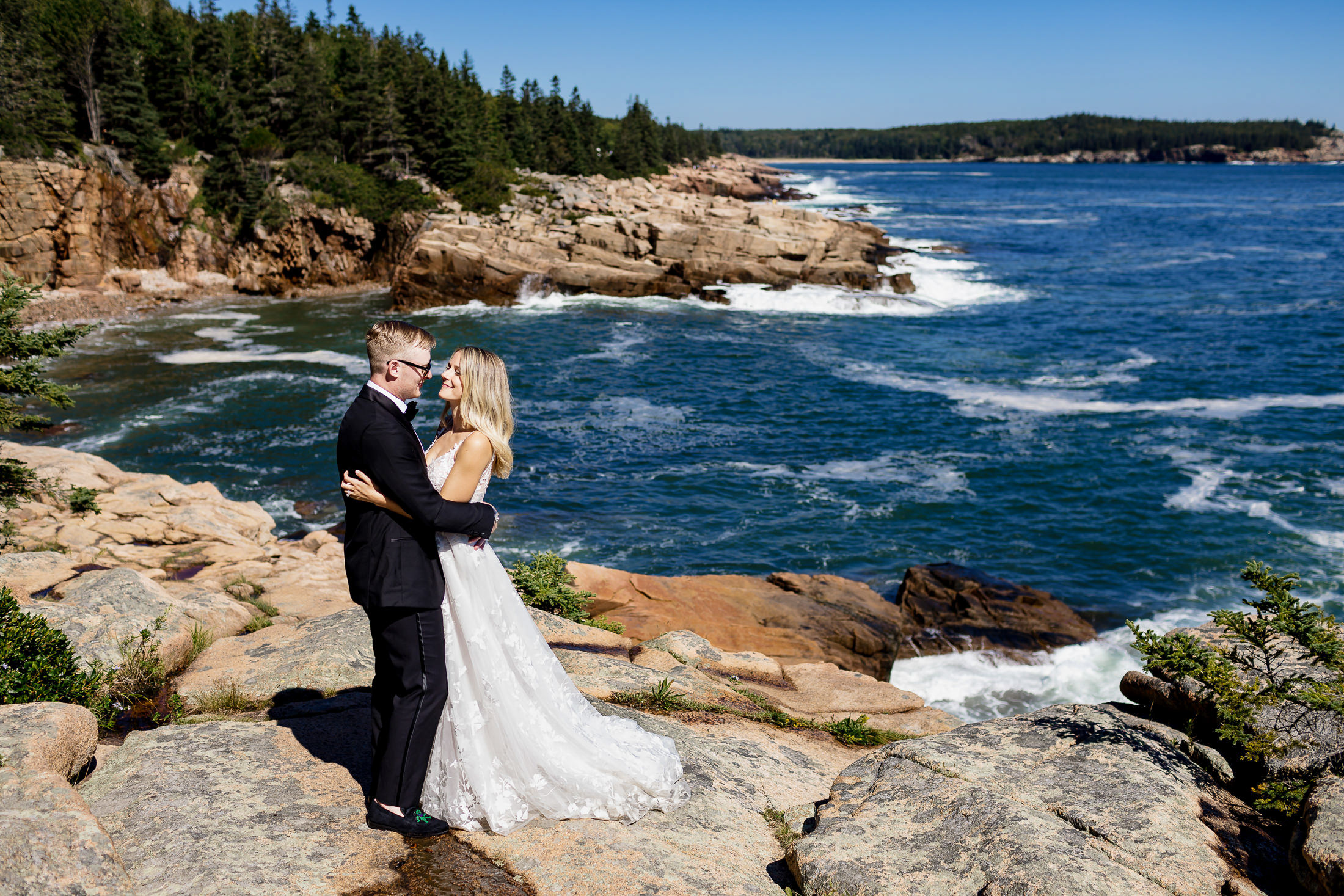 bride and groom on cliff during Acadia National Park wedding portraits