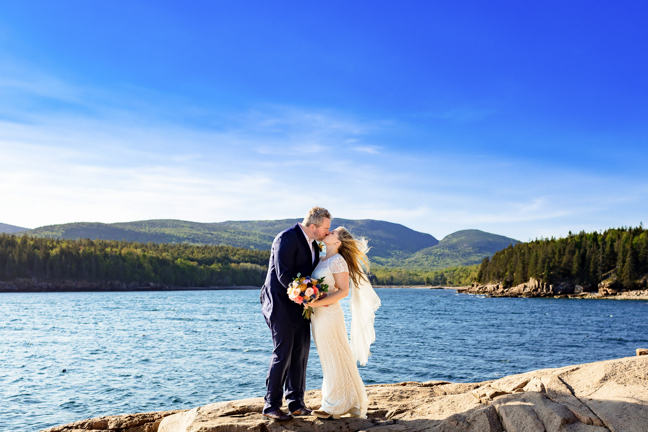 couple kissing at Otter Point during Acadia National Park elopement