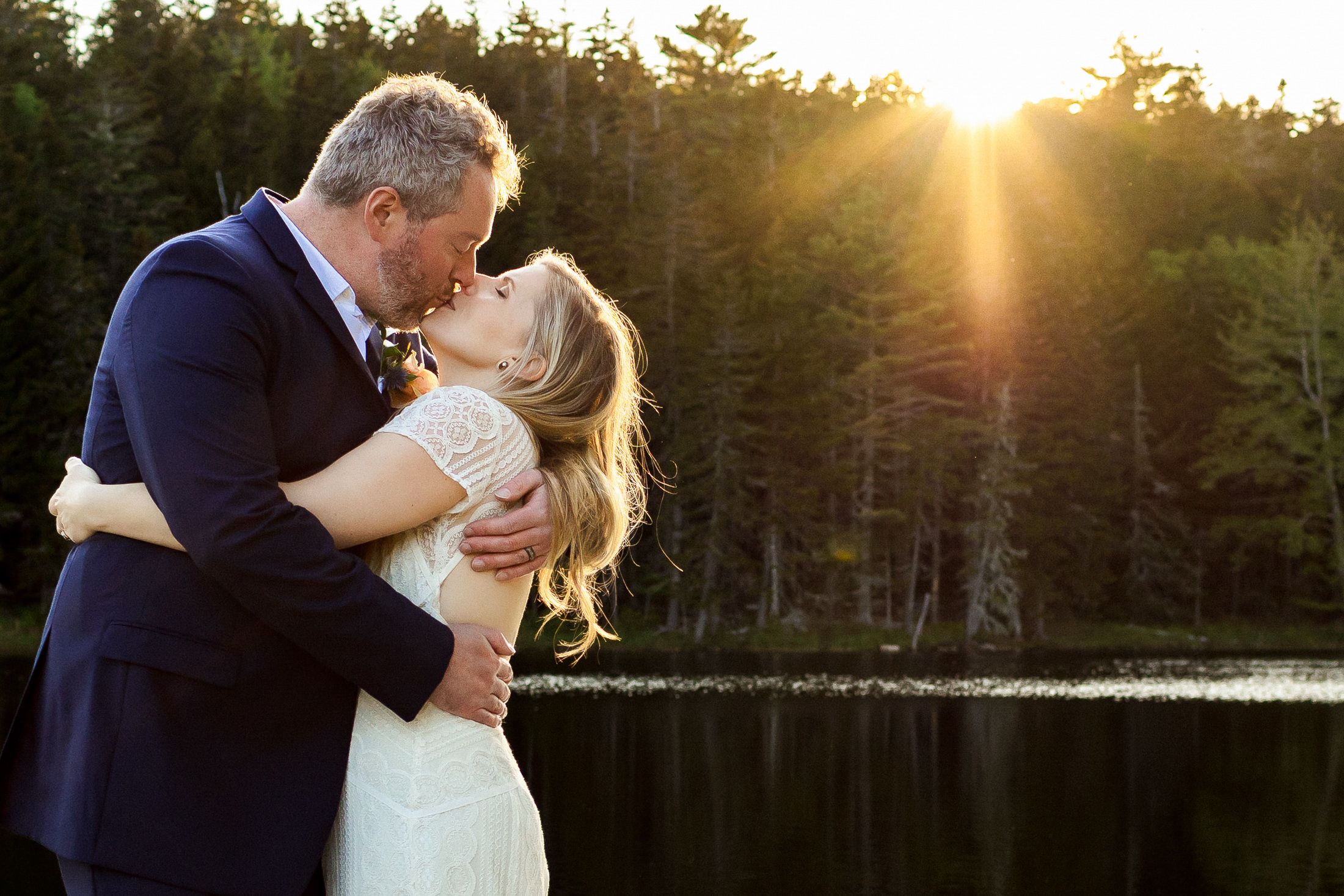 couple kissing in Acadia National Park after elopement