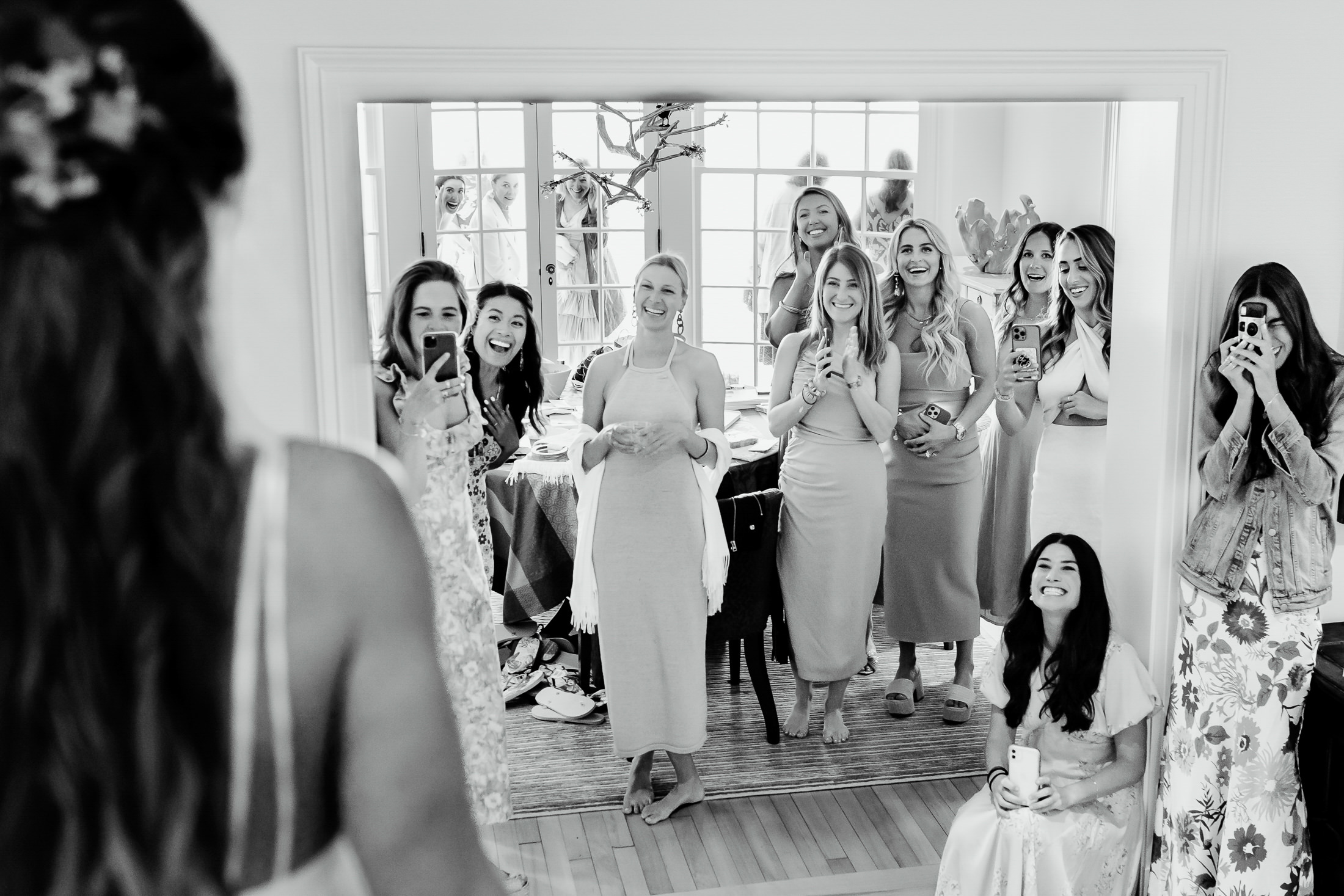 bride's first look with bridesmaids during Rockport Maine wedding